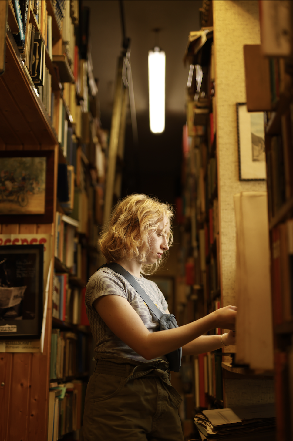 Hannah looking through some books